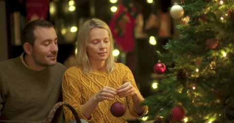 Couple decorating christmas tree Stock Footage 143789364