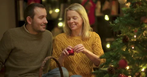 Couple decorating christmas tree Stock Footage 143789398