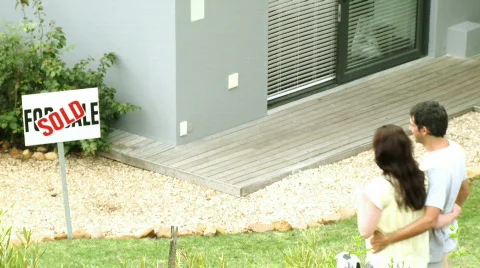Couple delighted to own a new house Stock Footage