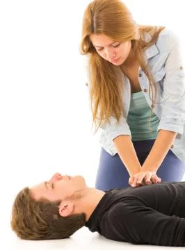 Couple demonstrating first aid techniques with woman applying cpr on male Foto stock