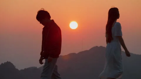 Couple departing split broke up walking in opposite direction of mountain Stock Footage 288167854