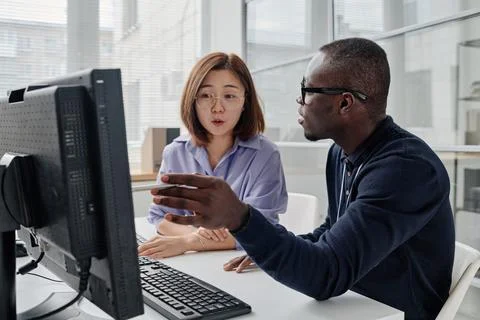 Couple of developers working on computer Stock Photos