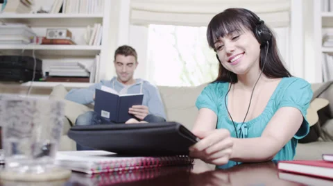 Couple with digital tablet technology. Student house accommodation. Flat share Видео 32938894