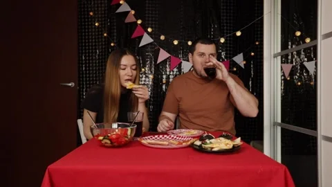 Couple Dining Together at Festive Table, friends toasting with glasses indo.. Stock Footage 289549583