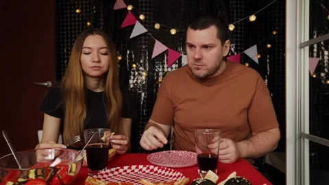 Couple Dining Together at Festive Table, father and teen daughter toasting .. Stock Footage 291411624