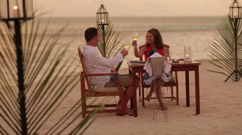 Couple dining on tropical beach Stock Footage 1018824