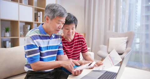 Couple discuss finances at home Stock Footage 137623053