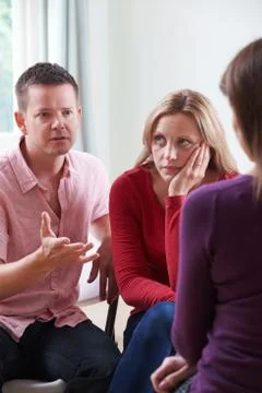 Couple Discussing Problems With Relationship Counsellor Stock Photos