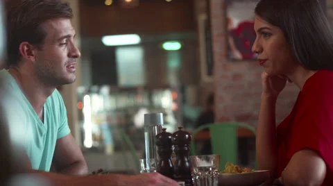 Couple discussing at restaurant. Stock Footage 64094380