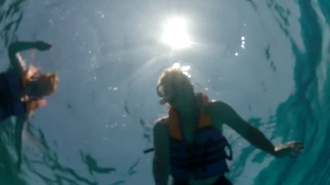 Couple Diving in Blue Ocean Stock Footage 73507706