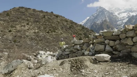 Couple do pictures among the mountains in Nepal. Manaslu area. Stock Footage 91684053