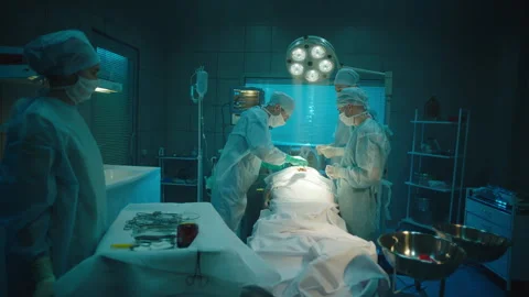 Couple of Doctors performing a surgery Stock Footage 283147303