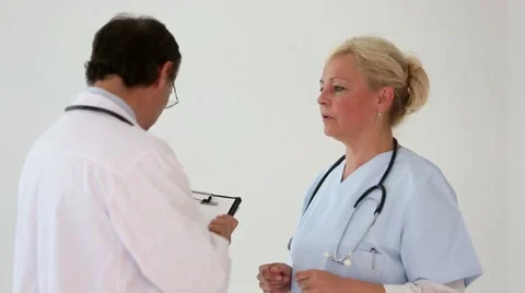 Couple of doctors talking and debating Stock Footage 52135236