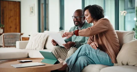 Couple, documents and tablet with budget in lounge for review, point and insight Stock Footage 335530241