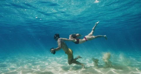 Couple does underwater workout together Stock Footage 105749204