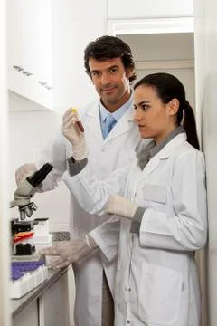Couple doing an experiment in the lab Фото