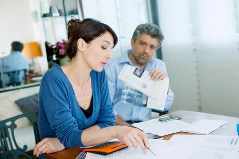 Couple doing paperwork Stock Photos