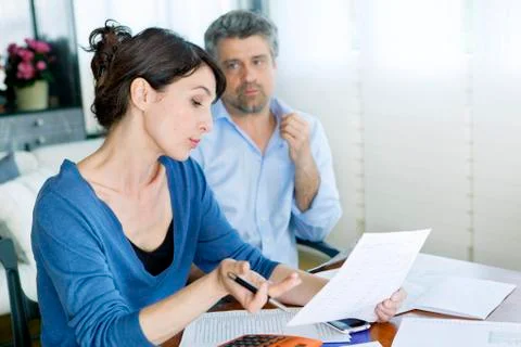 Couple doing paperwork Stock Photos