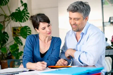 Couple doing paperwork Stock Photos