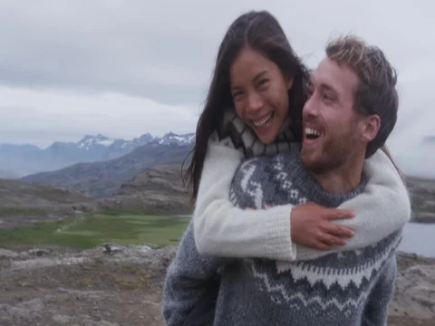 Couple doing piggyback having fun laughing joyful on Iceland Stock Footage