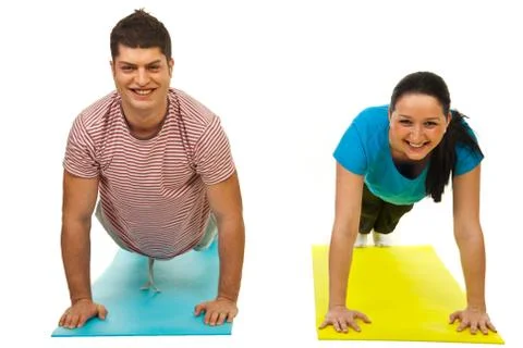 Couple doing push-ups Stock Photos