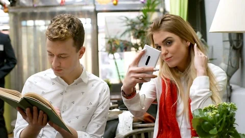 Couple doing selfies together while sitting in the cafe Stock Footage 71865296