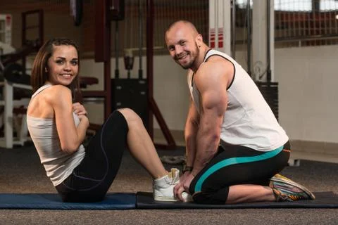 Couple Doing Sit-Ups Abdominal Crunch Stock Photos