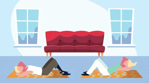 Couple doing sit ups at home during quarantine exercising on yoga mats. 库存影片 339211614