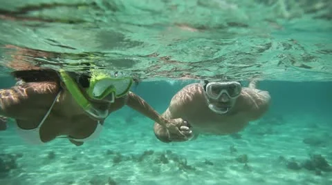 Couple doing snorkeling in caribbean sea Stock Footage