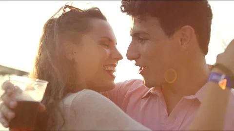 A couple drink while hugging Stock Footage 63082718