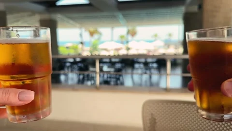 Couple drinking beer and making cheers and toast at the bar. Stock Footage 325075422