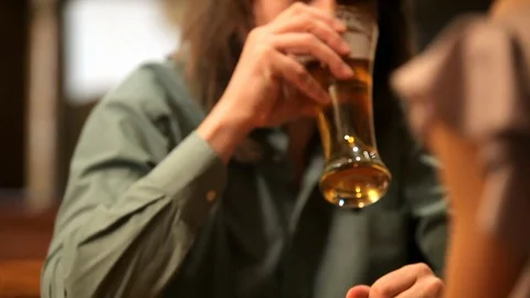Couple drinking beer in cafe Stock Footage 100240537