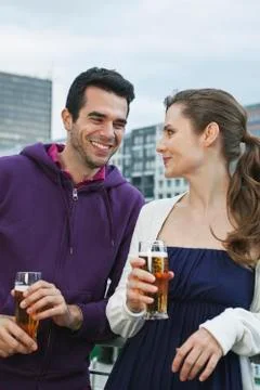 Couple drinking beverages Stock Photos