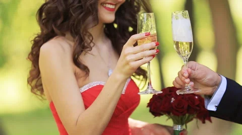 A couple drinking champagne crossing hands Stock Footage 64034045