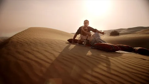 Couple drinking champagne on desert. Stock Footage 119379130