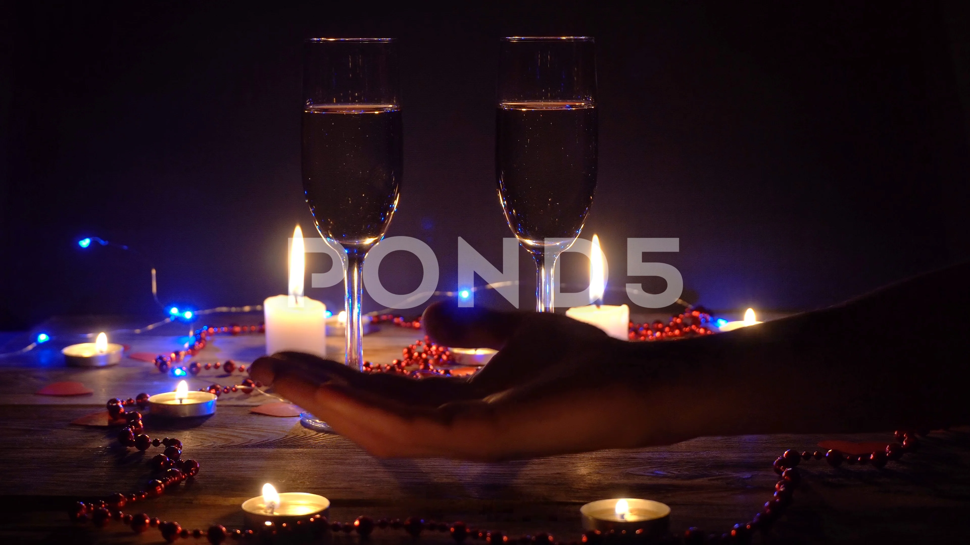 Couple drinking champagne, male stroking lady hand tenderly, romantic  evening