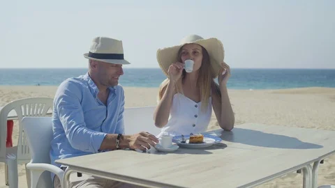 Couple drinking coffee and talking outdoor 動画素材 107427685