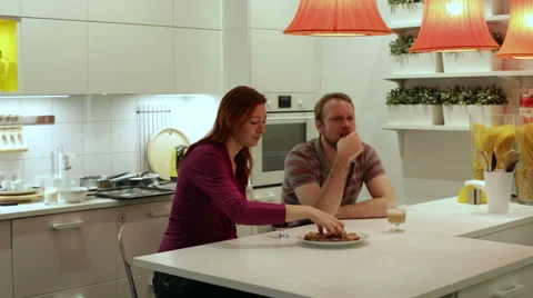 A couple drinking coffee with cookies Stock Footage 58637385