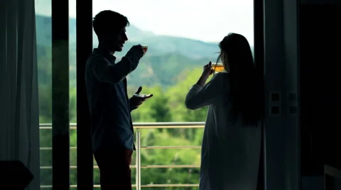 Couple drinking coffee, talking on terrace with great view HD Stock Footage 51237073