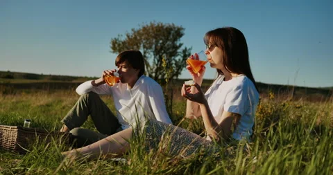 Couple drinking juice Stock Footage 153879534