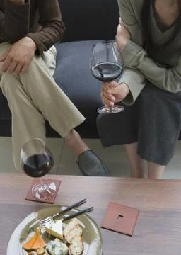 Couple drinking red wine Stock Photos
