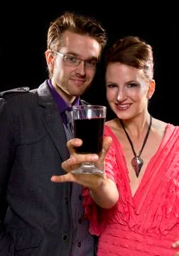 Couple drinking red wine Stock Photos
