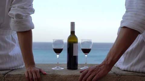 Couple drinking a red wine with romantic sea view Stock Footage 213544464