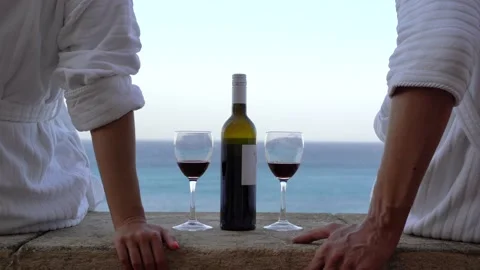 Couple drinking a red wine with romantic sea view Stock Footage 213544468