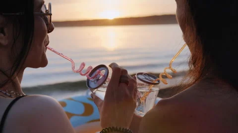 Couple drinking at sunset on beach Video stock 316359156