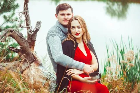 Couple drinking tea in the forest Stock Photos