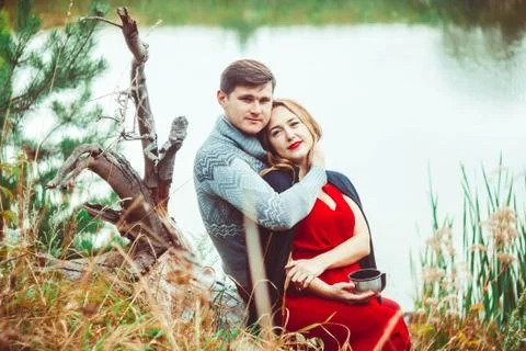Couple drinking tea in the forest Stock Photos
