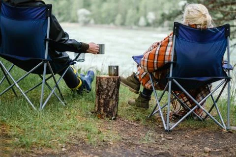Couple drinking tea in the forest. Stock Photos