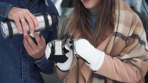 Couple drinking tea. Metal cups from a thermos on the nature Stock Footage 166745584