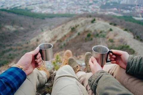 Couple drinking tea in the mountains Stock Photos